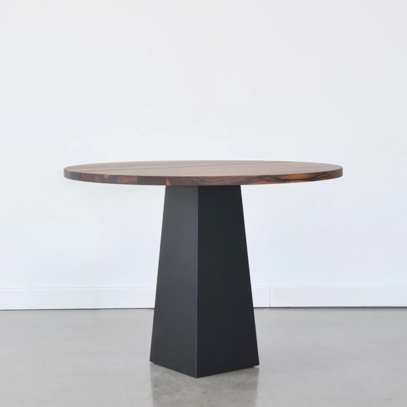 Small dining table with black pedestal base